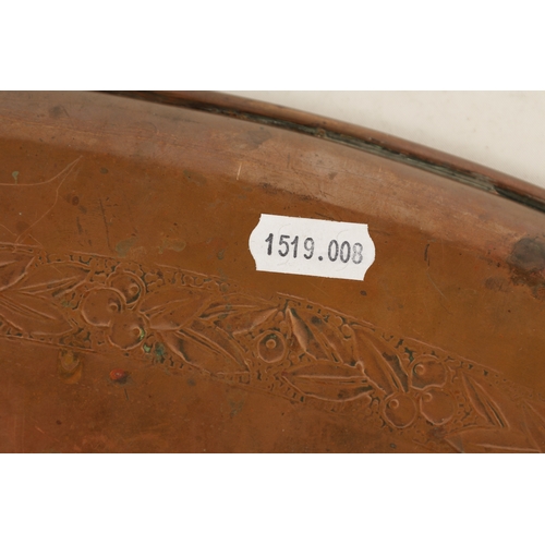 550 - AN ARTS AND CRAFTS OVAL PLENISHED COPPER TRAY with leaf and berry engraved inner border. (51cm wide ... 