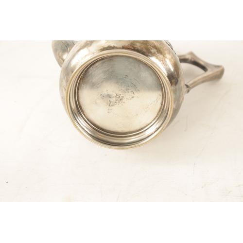 554 - A STYLISH ART NOUVEAU WMF LIBERTY'S-STYLE POLISHED PEWTER COFFEE POT with stylised floral designs to... 