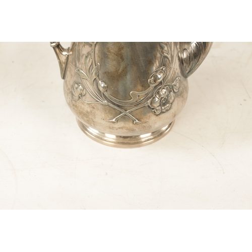 554 - A STYLISH ART NOUVEAU WMF LIBERTY'S-STYLE POLISHED PEWTER COFFEE POT with stylised floral designs to... 