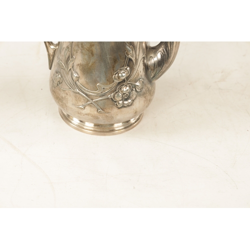 554 - A STYLISH ART NOUVEAU WMF LIBERTY'S-STYLE POLISHED PEWTER COFFEE POT with stylised floral designs to... 
