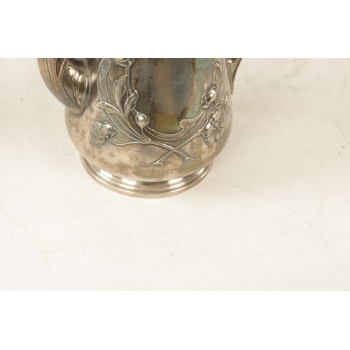 554 - A STYLISH ART NOUVEAU WMF LIBERTY'S-STYLE POLISHED PEWTER COFFEE POT with stylised floral designs to... 