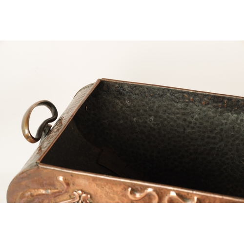 556 - AN ART NOUVEAU PLANISHED COPPER COAL BOX with lift-off lid and shaped body embossed with stylised fl... 