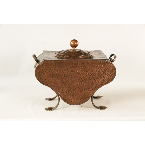 556 - AN ART NOUVEAU PLANISHED COPPER COAL BOX with lift-off lid and shaped body embossed with stylised fl... 