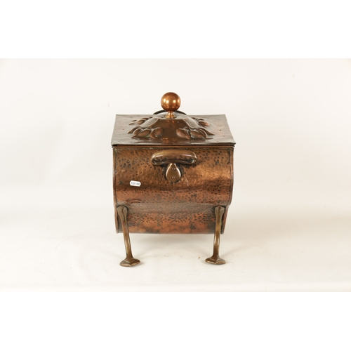 556 - AN ART NOUVEAU PLANISHED COPPER COAL BOX with lift-off lid and shaped body embossed with stylised fl... 