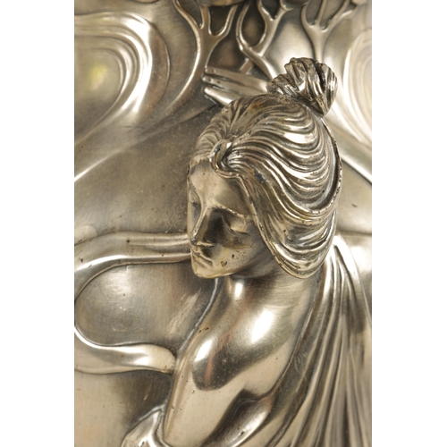 557 - A STYLISH LARGE PAIR OF ART NOUVEAU WMF PEWTER VASES WITH GREEN GLASS LINERS the petal shaped bases ... 