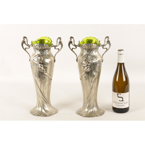 557 - A STYLISH LARGE PAIR OF ART NOUVEAU WMF PEWTER VASES WITH GREEN GLASS LINERS the petal shaped bases ... 