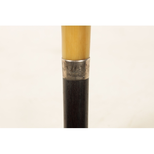 560 - A LATE 19TH CENTURY EBONY AND HORN WALKING CANE with silvered collar and tapering shaft. (91cm overa... 