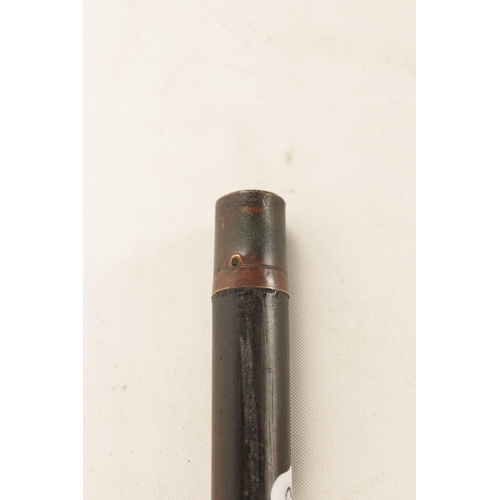 560 - A LATE 19TH CENTURY EBONY AND HORN WALKING CANE with silvered collar and tapering shaft. (91cm overa... 