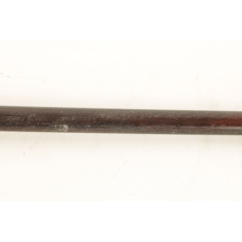 560 - A LATE 19TH CENTURY EBONY AND HORN WALKING CANE with silvered collar and tapering shaft. (91cm overa... 