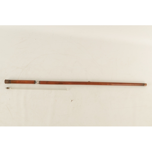 564 - A LATE 19TH CENTURY DECANTER WALKING STICK WITH SCREW OFF HANDLE with copper mounts revealing a elon... 
