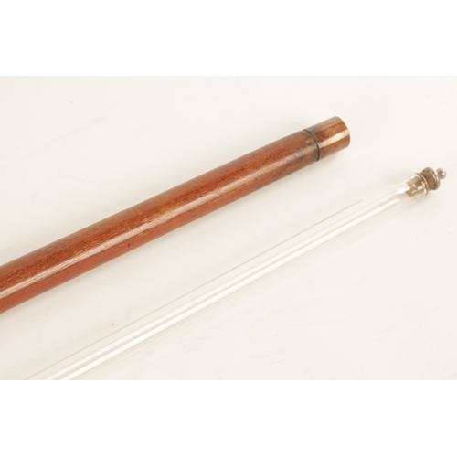 564 - A LATE 19TH CENTURY DECANTER WALKING STICK WITH SCREW OFF HANDLE with copper mounts revealing a elon... 