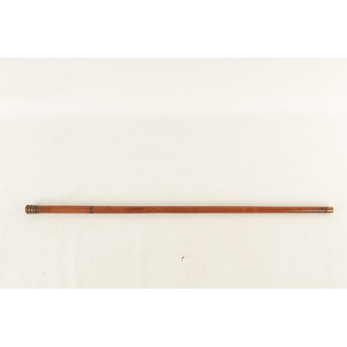 564 - A LATE 19TH CENTURY DECANTER WALKING STICK WITH SCREW OFF HANDLE with copper mounts revealing a elon... 