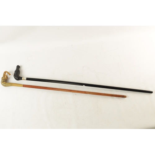 567 - A 19TH CENTURY EBONISED WALKING CANE AND ANOTHER ELEPHANT'S HEAD WALKING STICK the ebonised cane wit... 