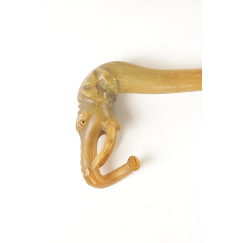567 - A 19TH CENTURY EBONISED WALKING CANE AND ANOTHER ELEPHANT'S HEAD WALKING STICK the ebonised cane wit... 