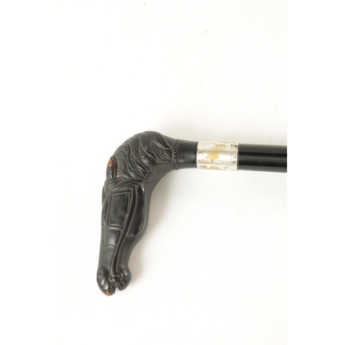 567 - A 19TH CENTURY EBONISED WALKING CANE AND ANOTHER ELEPHANT'S HEAD WALKING STICK the ebonised cane wit... 