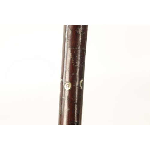 570 - A GOOD MID-19TH CENTURY FOLK ART MARRIAGE WALKING STICK inlaid with brass stud work and mother-of-pe... 