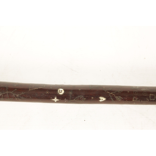 570 - A GOOD MID-19TH CENTURY FOLK ART MARRIAGE WALKING STICK inlaid with brass stud work and mother-of-pe... 