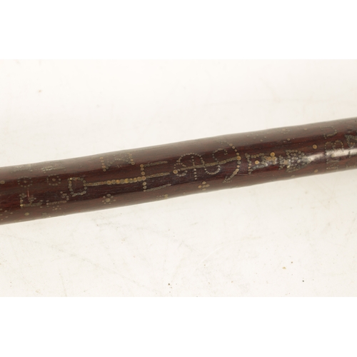 570 - A GOOD MID-19TH CENTURY FOLK ART MARRIAGE WALKING STICK inlaid with brass stud work and mother-of-pe... 