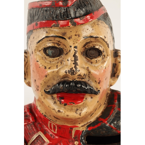 577 - AN EARLY 20TH CENTURY PAINTED CAST IRON MECHANICAL 