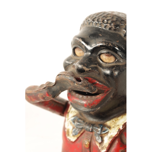579 - A LATE 19TH CENTURY PAINTED CAST IRON 'JOLLY' MECHANICAL MONEY BANK (16cm high)