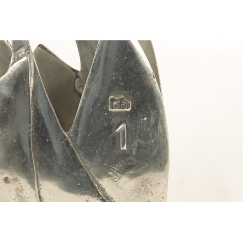 588 - A STYLISH BRONZE AND STEEL MARITIME SCULPTURE, possibly a racing trophy, modelled as sailing boats w... 