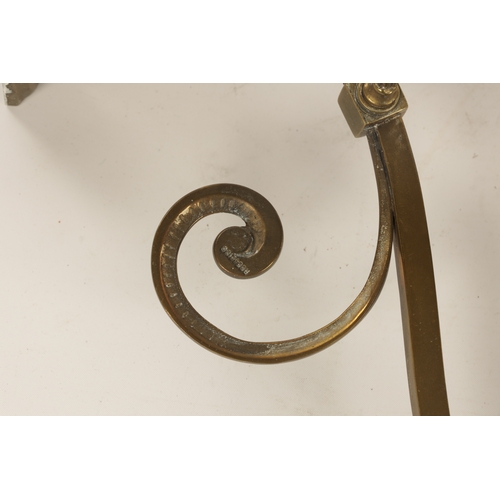 589 - A PAIR OF ELECTRIFIED BRASS WALL LIGHTS with scrolled arms and cut glass pendant shades on brass fit... 
