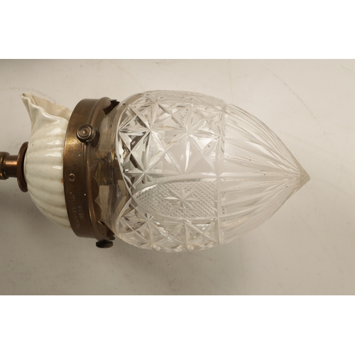 589 - A PAIR OF ELECTRIFIED BRASS WALL LIGHTS with scrolled arms and cut glass pendant shades on brass fit... 