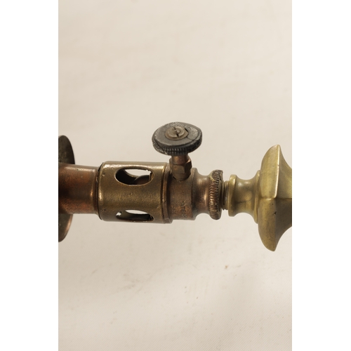 589 - A PAIR OF ELECTRIFIED BRASS WALL LIGHTS with scrolled arms and cut glass pendant shades on brass fit... 