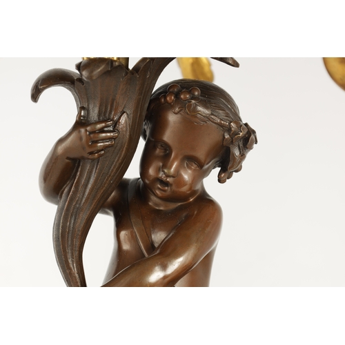 591 - A PAIR OF 19TH CENTURY BRONZE AND ORMOLU SEVEN BRANCH CANDLELARBRA with leaf and flower head decorat... 