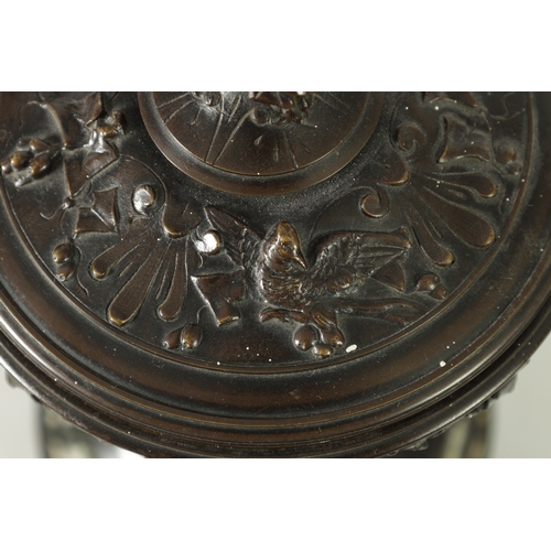 593 - A 19TH CENTURY BRONZE LIDDED TAZZA with figural finial and stylised floral decoration, raised on a g... 