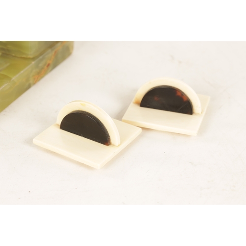 595 - ATT. JOSEF LORENZL. AN ART DECO SILVERED BRONZE FIGURAL INKSTAND modelled as a smoking girl seated o... 