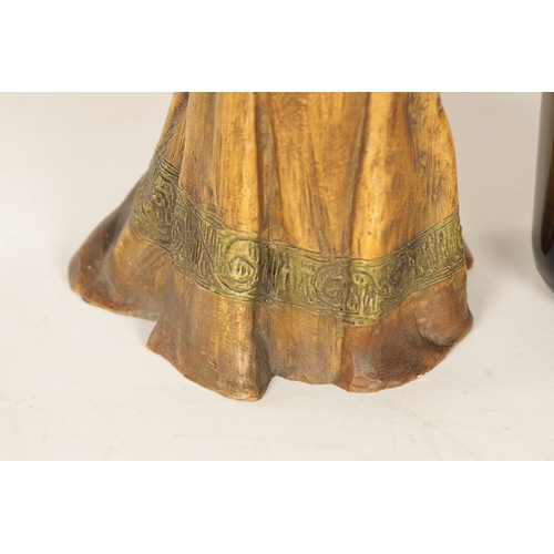 600 - AN AUSTRIAN COLD PAINTED TERRACOTTA FIGURE BY GOLDSCHEIDER modelled as a young girl in cream dress, ... 