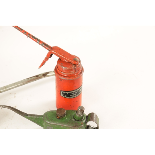 12 - A COLLECTION OF THREE VINTAGE GARAGE CANISTERS comprising two oil cans and a grease gun. (42cm and s... 