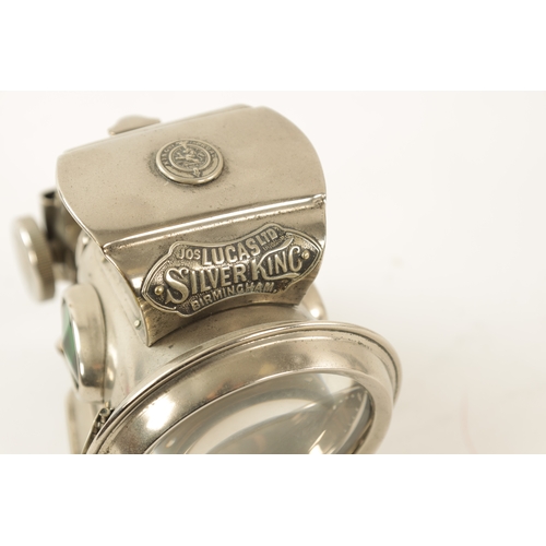 27 - A VINTAGE LUCAS SILVER KING BIRMINGHAM CYCLE LIGHT with clear lens and green-coloured glass side rep... 