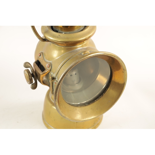 28 - A BRASS LUCAS 721 'KING OF THE ROAD' OIL SIDE LAMP with two-tier chimney and loop handle. (32cm high... 