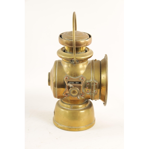 28 - A BRASS LUCAS 721 'KING OF THE ROAD' OIL SIDE LAMP with two-tier chimney and loop handle. (32cm high... 