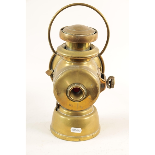 28 - A BRASS LUCAS 721 'KING OF THE ROAD' OIL SIDE LAMP with two-tier chimney and loop handle. (32cm high... 