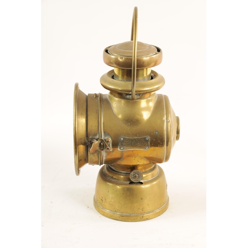 28 - A BRASS LUCAS 721 'KING OF THE ROAD' OIL SIDE LAMP with two-tier chimney and loop handle. (32cm high... 