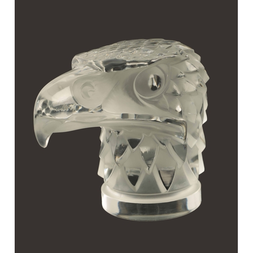 3 - A RENE LALIQUE 'TETE D'AIGLE' CLEAR AND FROSTED GLASS CAR MASCOT on a circular base moulded signatur... 