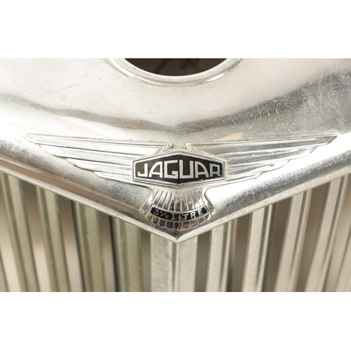 32 - A VINTAGE JAGUAR 3 1/2 LITRE CHROMED RADIATOR GRILL with black enamelled badges. (60cm wide, 68cm hi... 