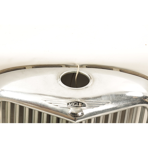 32 - A VINTAGE JAGUAR 3 1/2 LITRE CHROMED RADIATOR GRILL with black enamelled badges. (60cm wide, 68cm hi... 