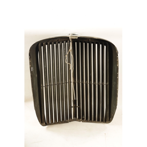 32 - A VINTAGE JAGUAR 3 1/2 LITRE CHROMED RADIATOR GRILL with black enamelled badges. (60cm wide, 68cm hi... 