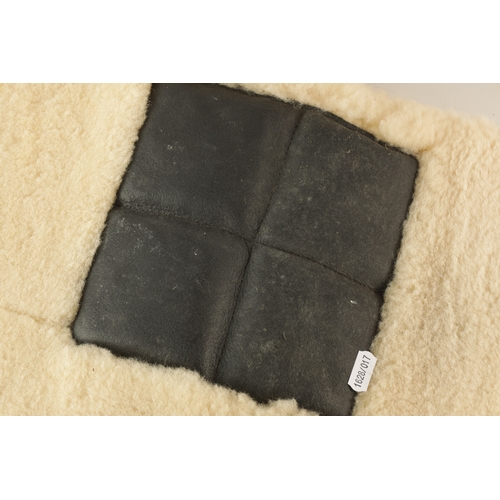 33 - TWO SHEEPSKIN FOOTWELL MATS POSSIBLY FOR A FERRARI