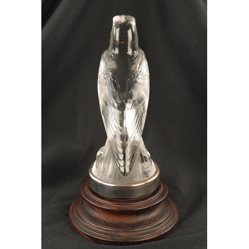 4 - A RENE LALIQUE 'FAUCON' CLEAR AND FROSTED GLASS CAR MASCOT mounted with a chrome circular collar on ... 