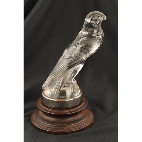 4 - A RENE LALIQUE 'FAUCON' CLEAR AND FROSTED GLASS CAR MASCOT mounted with a chrome circular collar on ... 