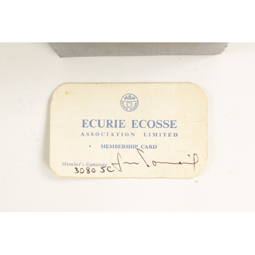 63 - AN ECURIE ECOSSE ENAMEL BUMPER BADGE with membership card number L/74 (8cm wide)