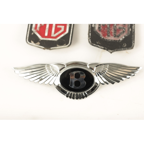 66 - A COLLECTION OF MOTORING BADGES comprising two signed Bentley patches and hood badge, a Jersey Motor... 