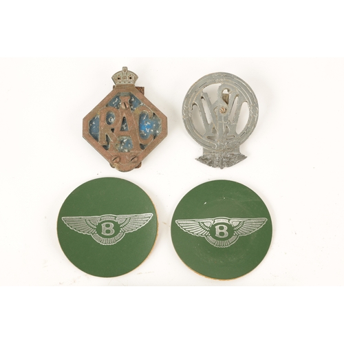 66 - A COLLECTION OF MOTORING BADGES comprising two signed Bentley patches and hood badge, a Jersey Motor... 