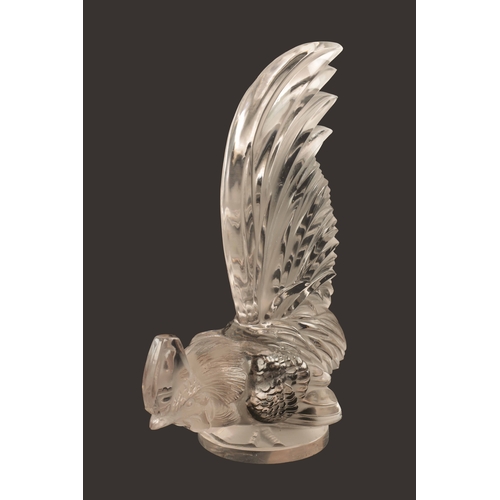 7 - A RENE LALIQUE 'COQ NAIN' CLEAR GLASS AND FROSTED CAR MASCOT on a circular base engraved 'FRANCE' an... 