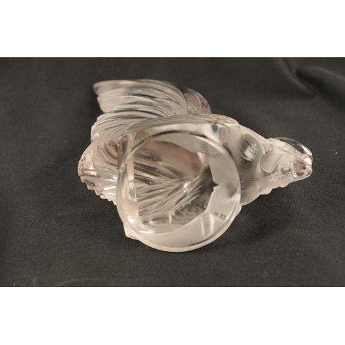 7 - A RENE LALIQUE 'COQ NAIN' CLEAR GLASS AND FROSTED CAR MASCOT on a circular base engraved 'FRANCE' an... 